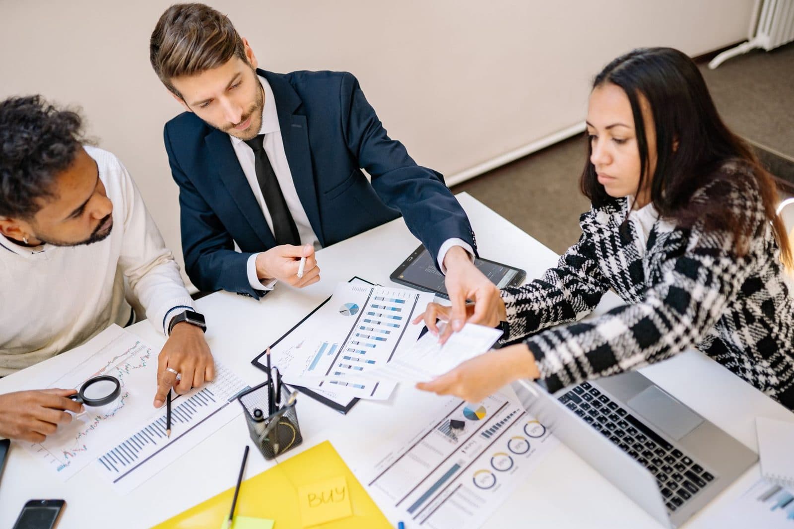 A reputation management team collaborating around a table