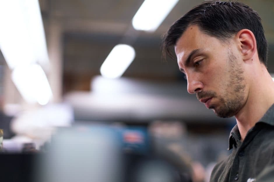 A focused professional concentrating on detailed work